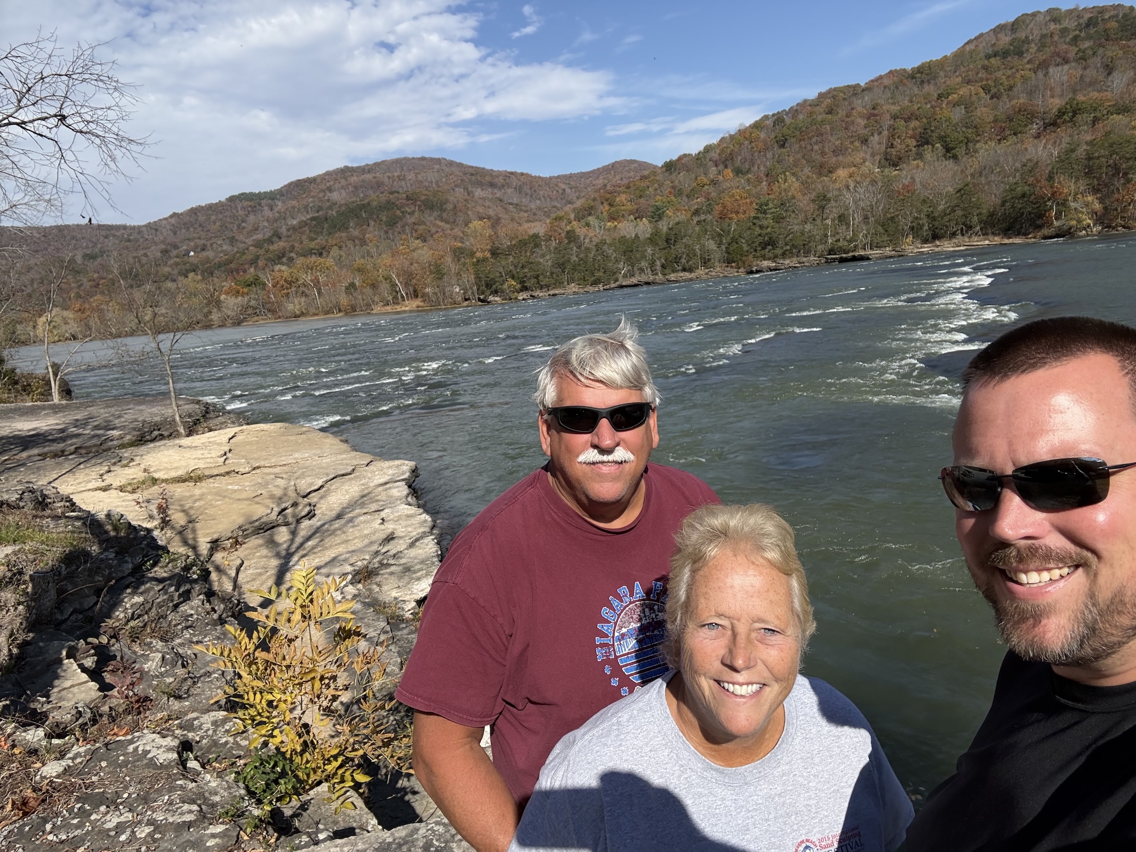 Dad, Mom, and I in front of Brooks Falls